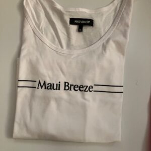 Folded white tank top reading "Maui Breeze"